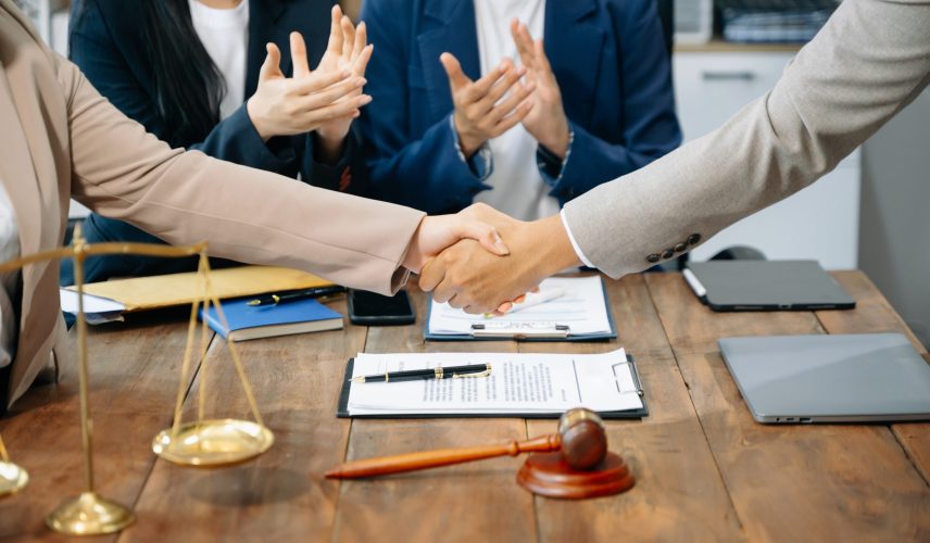 Business team and Male lawyer or judge consult having team meeting with client, Law and Legal services concept.Customer service good cooperation