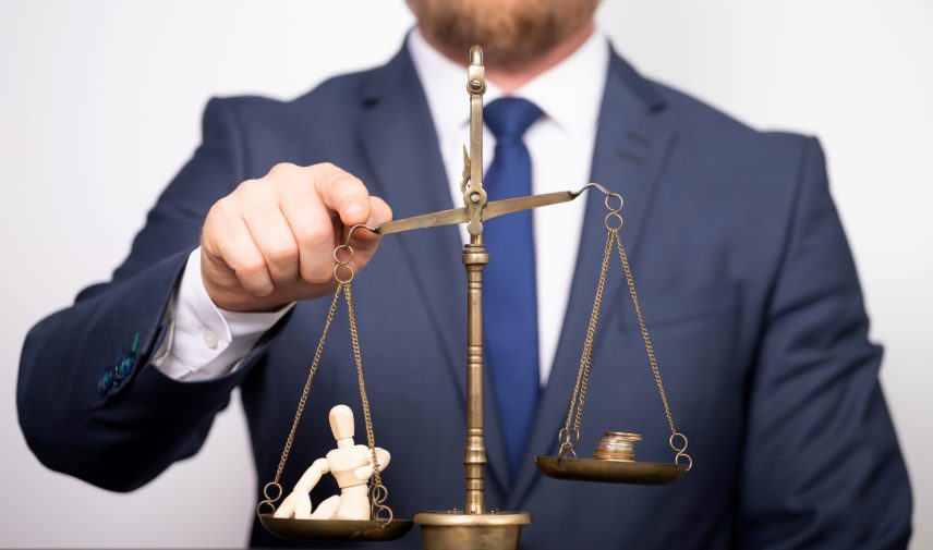 Conceptual financial and business photo of scale with people on one pan and money on the other showing balance