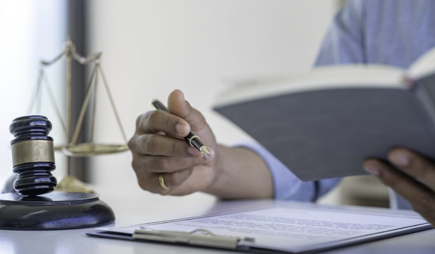 Attorney or Judge gavel with Justice lawyers, Business man  or lawyer working on a documents. Legal law and is consulting and legal advice, advice and justice concept.