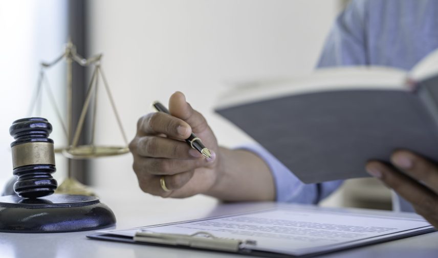 Attorney or Judge gavel with Justice lawyers, Business man  or lawyer working on a documents. Legal law and is consulting and legal advice, advice and justice concept.